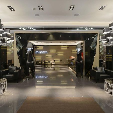 M Hotel Caotun Bagian luar foto